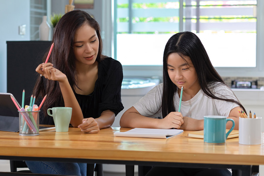 student and tutor together at a desk in Detroit